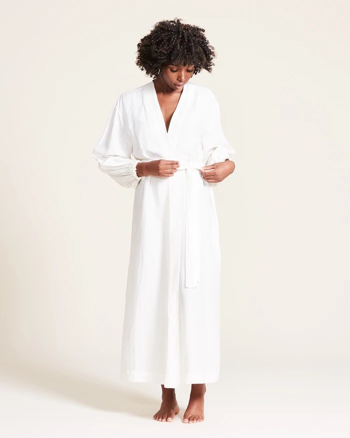 Black woman wearing white robe