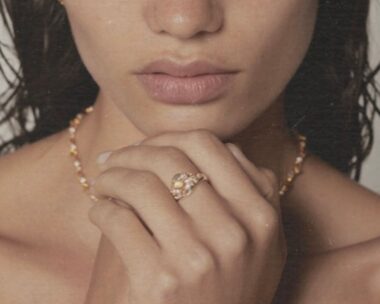 A model poses wearing a gold signet ring from Sarah and Sebastian.