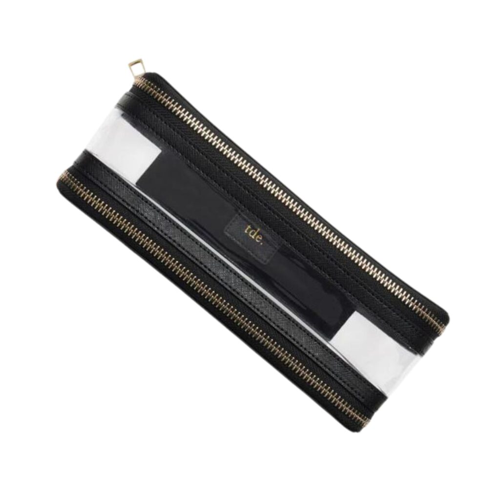 Black with gold hardware and a clear PVC case the dual chamber The Daily Edited Black Clear Travel Case is perfect for storing all of your cosmetics. 