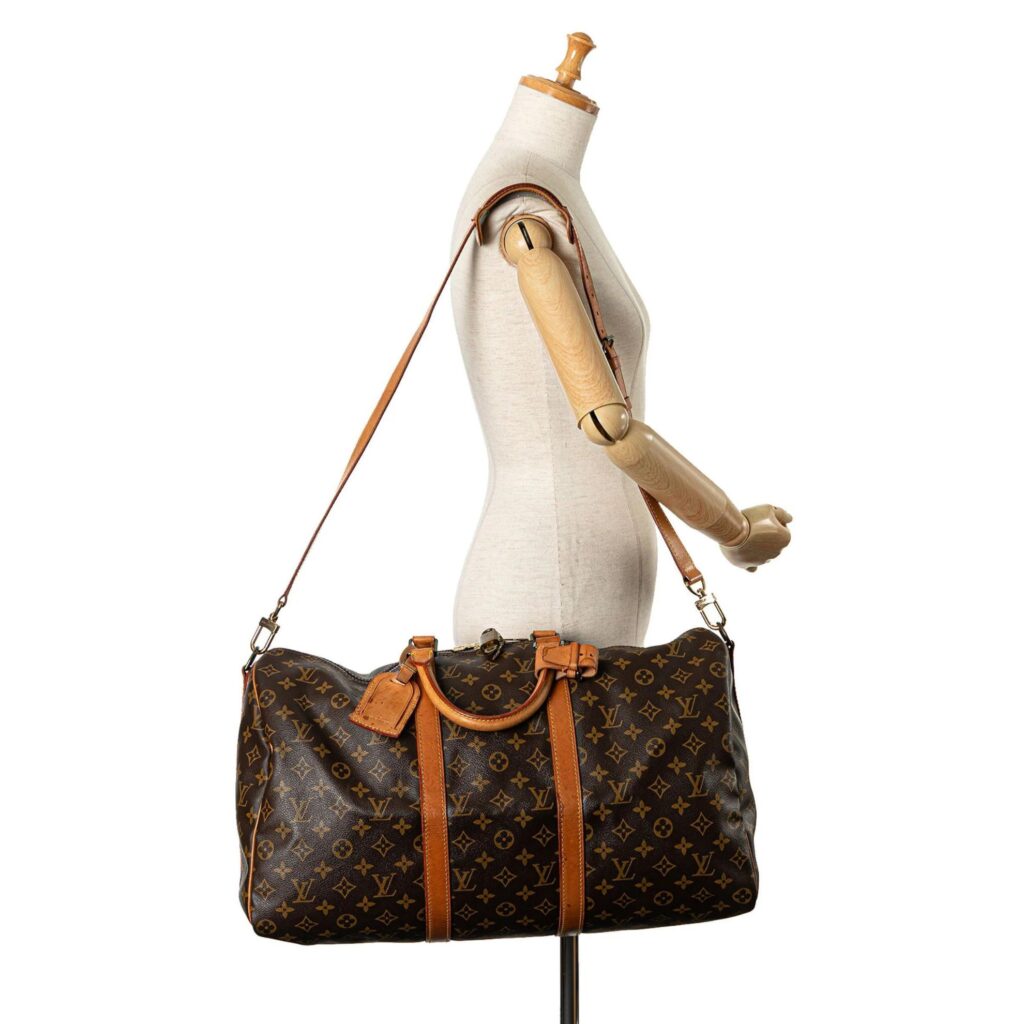 The vintage Louis Vuitton, 1990 Monogram Keepall Bandouliere 50 Travel Bag is a steal at $1638, a true piece of vintage that will keep all of your personal items on hand. The long detachable leather strap makes for easy carrying and the handle and package tag are also made of leather.