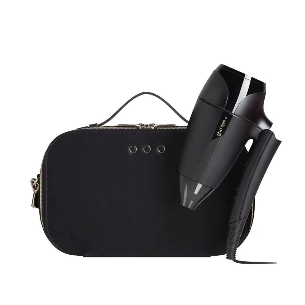 The GHD Flight Travel Hair Dryer folds in on itself neatly and is 25% smaller than standard ghd hairdryers, pictured here with it's case.