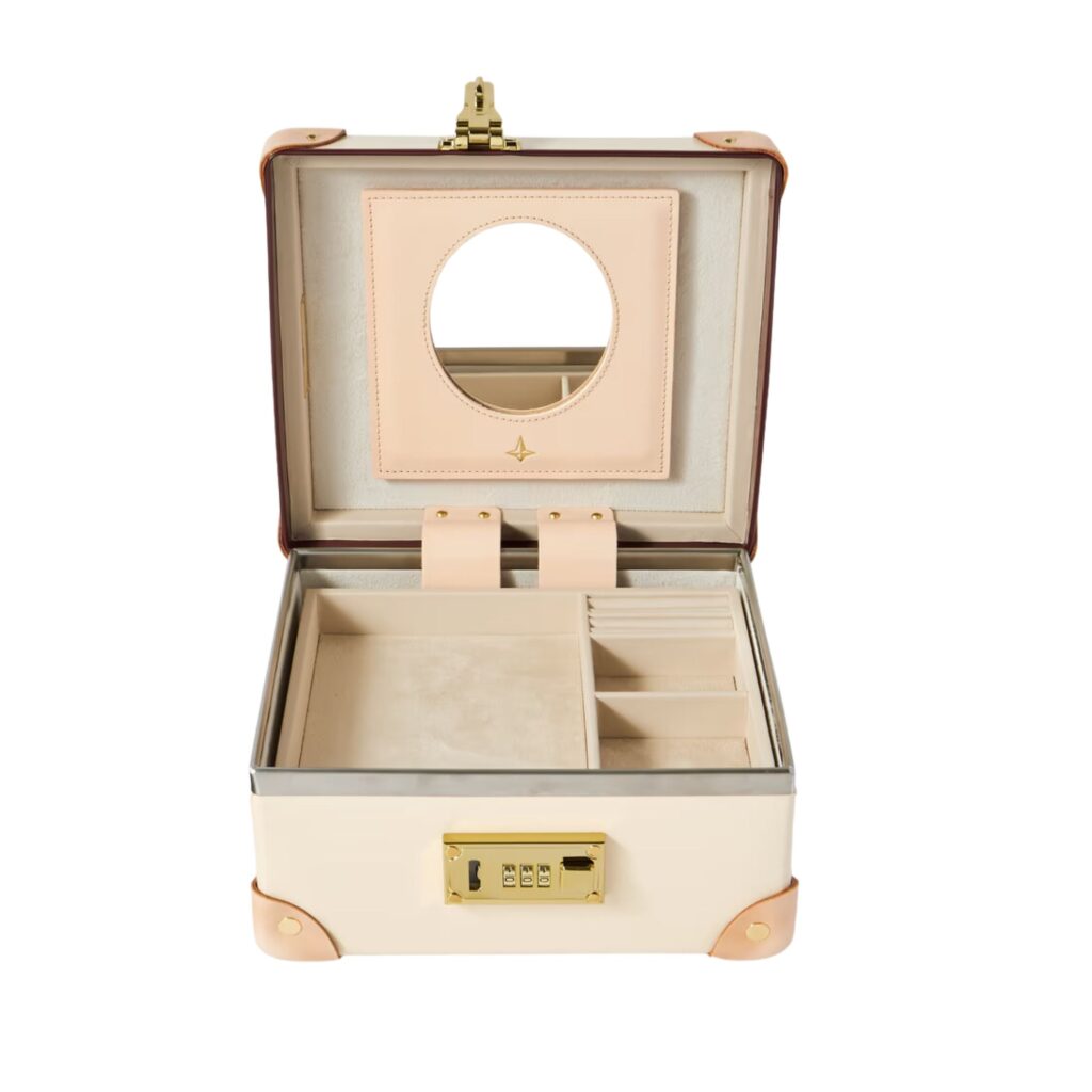 Globe-Trotter Safari Leather-Trimmed Jewellery Case in ivory features a combination lock and removable tray to make room for more of your precious items. 