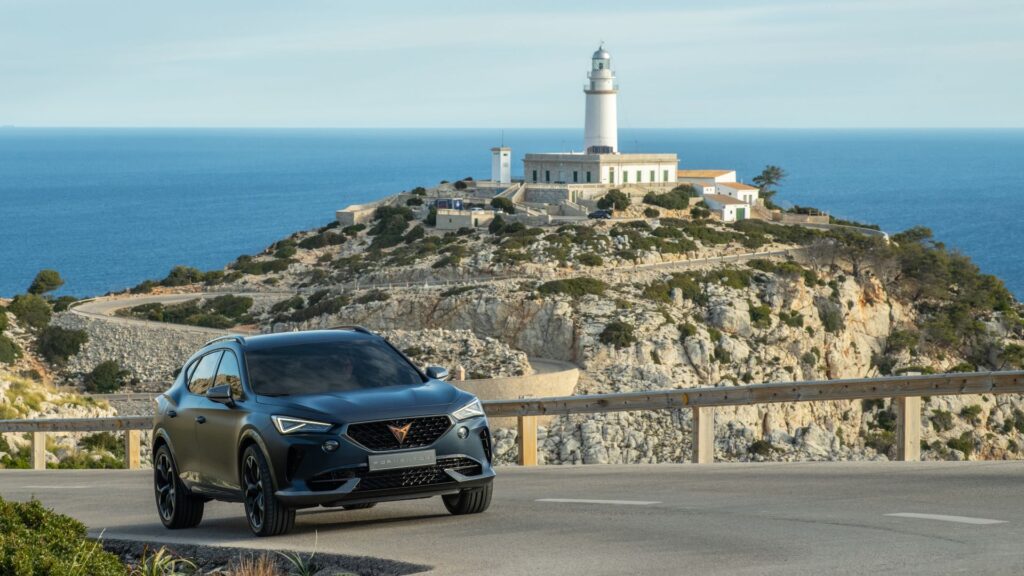 cupra car and lighthouse in spain