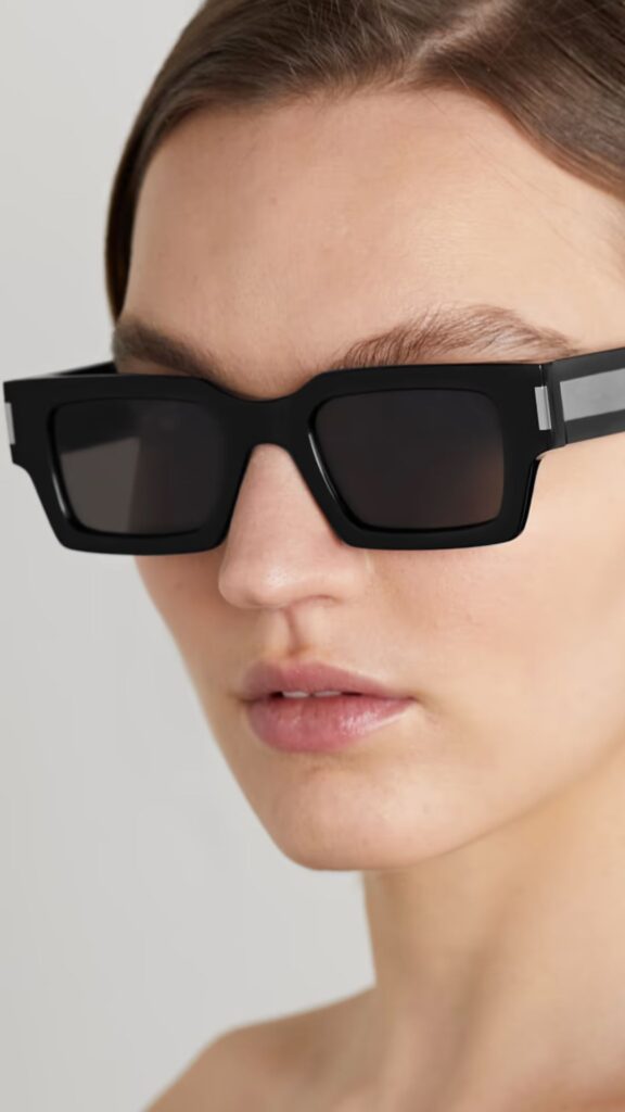 Rectangular Saint Laurent frames with a glossy black acetate finish. 