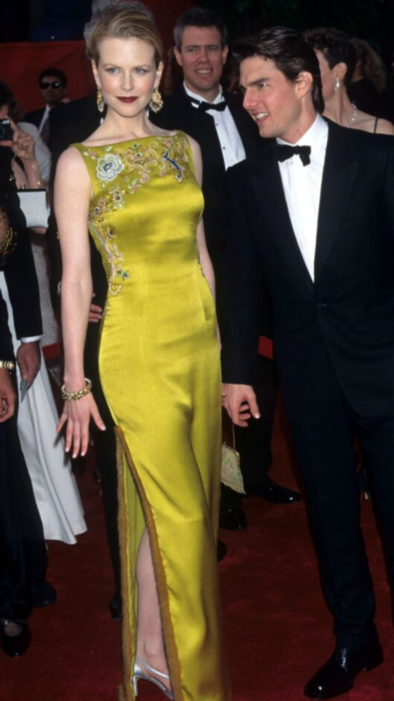 Nicole Kidman in green dress and Tom Cruise in black suit on Oscars red carpet 