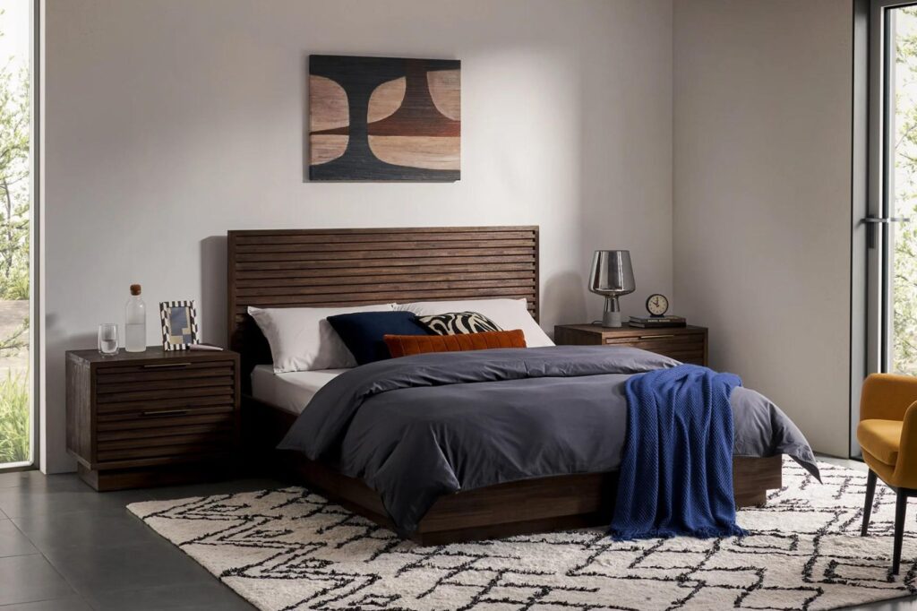 The Castlery Emery Bed has a rustic wooden bed frame.