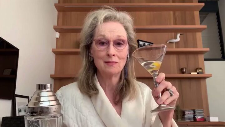 Meryl Streep drinks a cocktail.