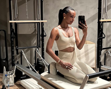 Model Jasmine Tookes on a reformer pilates machine