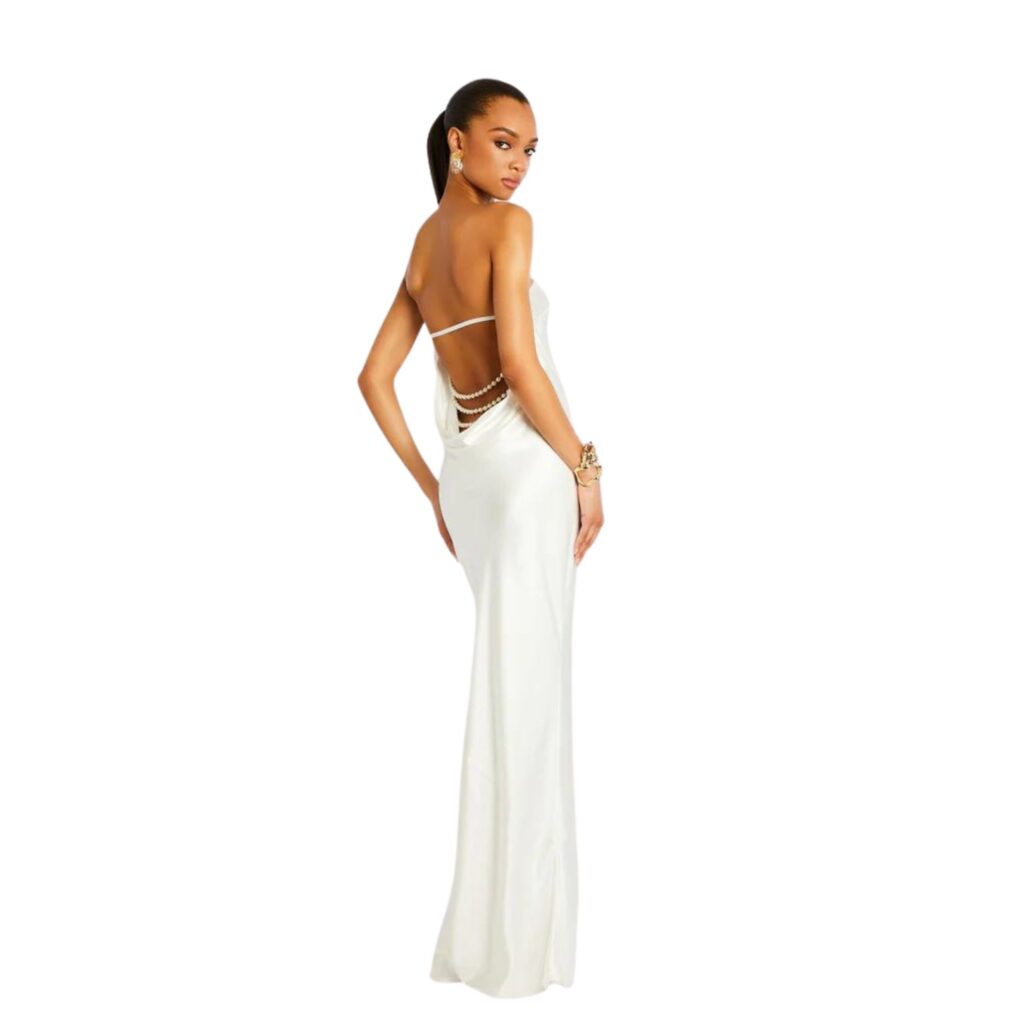 Retrofête are one of our favourite affordable wedding dress brands, loved by celebrities from Gigi Hadid, to Beyonce. Pictured is their Wendi Pearl a backless satin gown with two strands of pearls across the lower back.