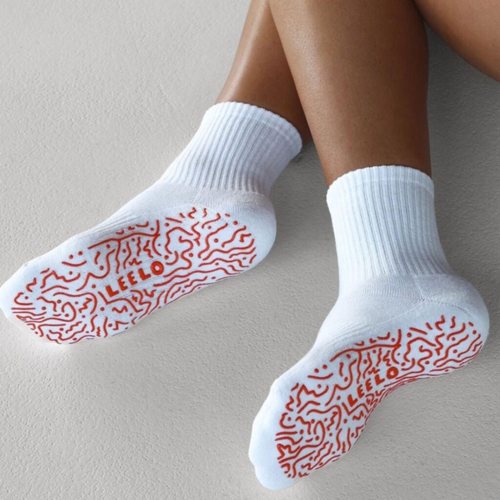 This Australian-made pilates sock brings plenty of fun to the pilates party. Its bespoke swirling orange design on the foot adds plenty of grip. The breathable white 100% cotton weave fabric is luxe and plush, and the splash of colour at the base will elevate any pilates or yoga session. $24.99 at The Iconic.