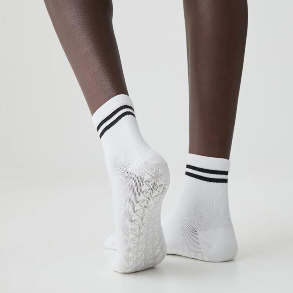 With a simple, minimalist design you'll feel like the coolest girl in the studio wearing these half-crew socks from Aje Athletica ($30.00). The striped cuff is ribbed for comfort and the triangular grips on the soles provide extra security. Pictured are the white socks with black stripes. 