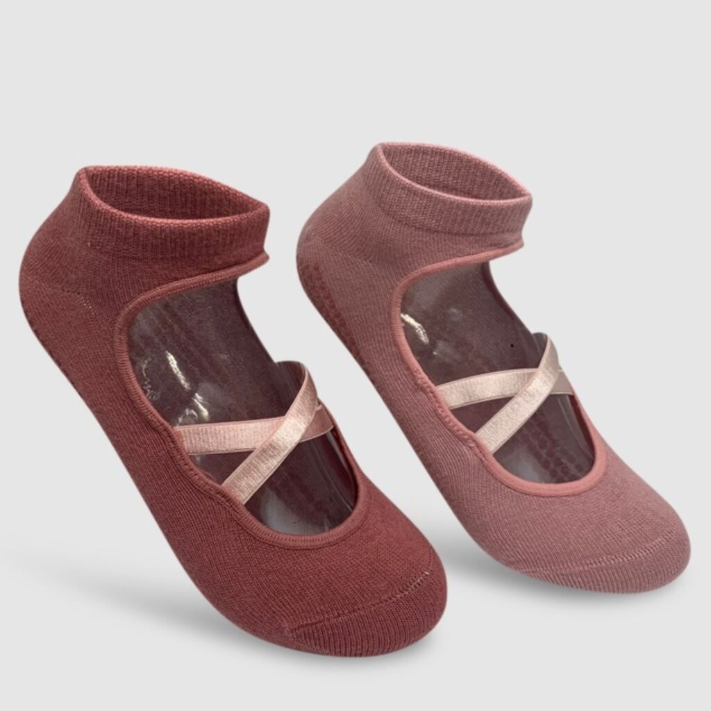 The High Heel Jungle Pilates Grip Socks incorporate elements of balletcore with a ribbon criss cross across the front of the foot and a low toe. They feature fool foot silicone grip and and elevated arch support. Each pack comes with two pairs, pictured here are the ballet pink and blush set. Also available in black and grey. They are $45.00 for a set at The Iconic. 
