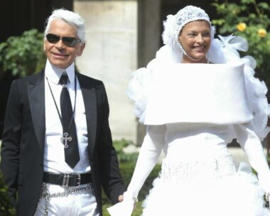 Karl Lagerfeld and Linda Evangelista at the chanel couture show in 2003. Evangalista plays the bride in a white dress and head wrap
