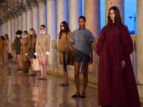 Models line up at the max mara resort 25 show.