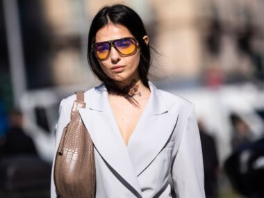 Doina Ciobanu, wearing Carrera sunglasses and grey jacket and pants, is seen outside Sportmax on Day 3 Milan Fashion Week Autumn/Winter