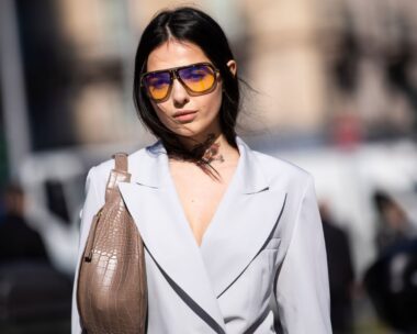 Doina Ciobanu, wearing Carrera sunglasses and grey jacket and pants, is seen outside Sportmax on Day 3 Milan Fashion Week Autumn/Winter