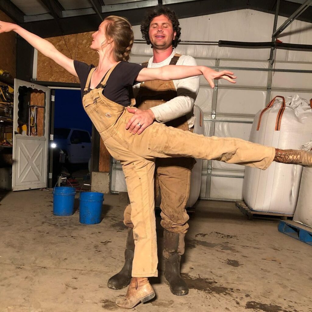 Daniel Neeleman holds wife Hannah Neeleman in a supported ballet posture.