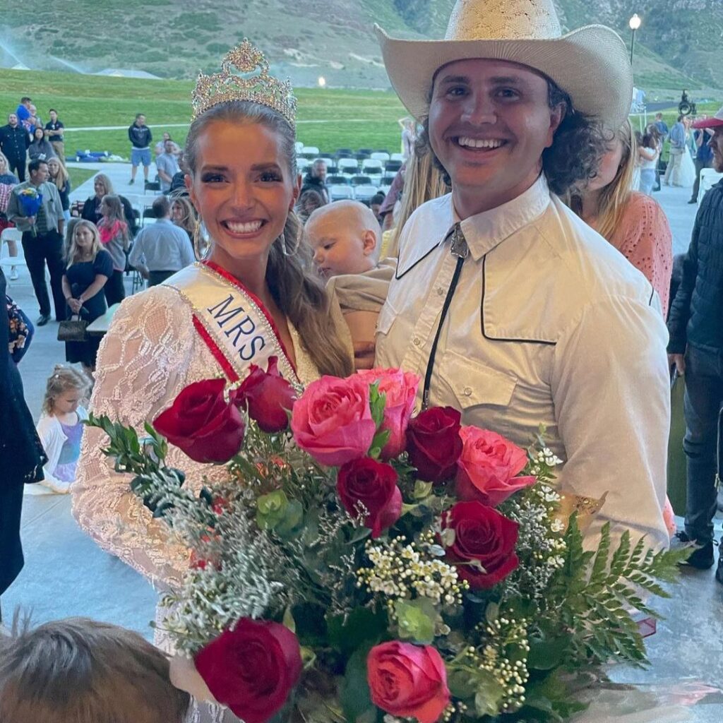 Hannah and Daniel Neeleman with one of their children following Hannah's Mrs Universe win.