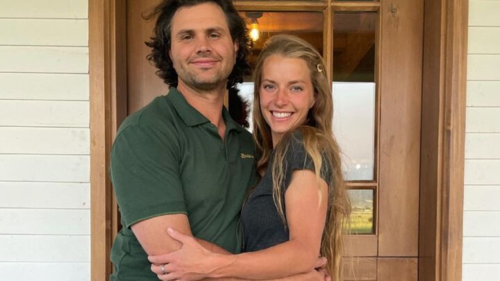 Hannah and Daniel Neeleman of Ballerina Farm fame pose outside their house.