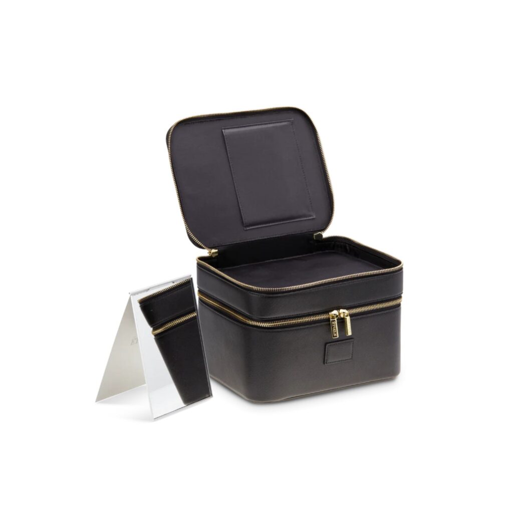 This hard case "vanity bag" features two compartments and a versatile insert. Remove the insert and make room for larger items like eyeshadow palettes. Keep it in, and it will ensure cleansers, moisturisers and foundations are upright. There are elastics for slipping makeup brushes and toothbrushes into, while the second compartment has room for more slender items and a slender fold-out compact mirror. It has a similar structure to the popular Celine Travel Vanity Case ($1,850) while ringing in at a fraction of the price. It has gold zippers and a compact mirror that can be removed and positioned beside it. 