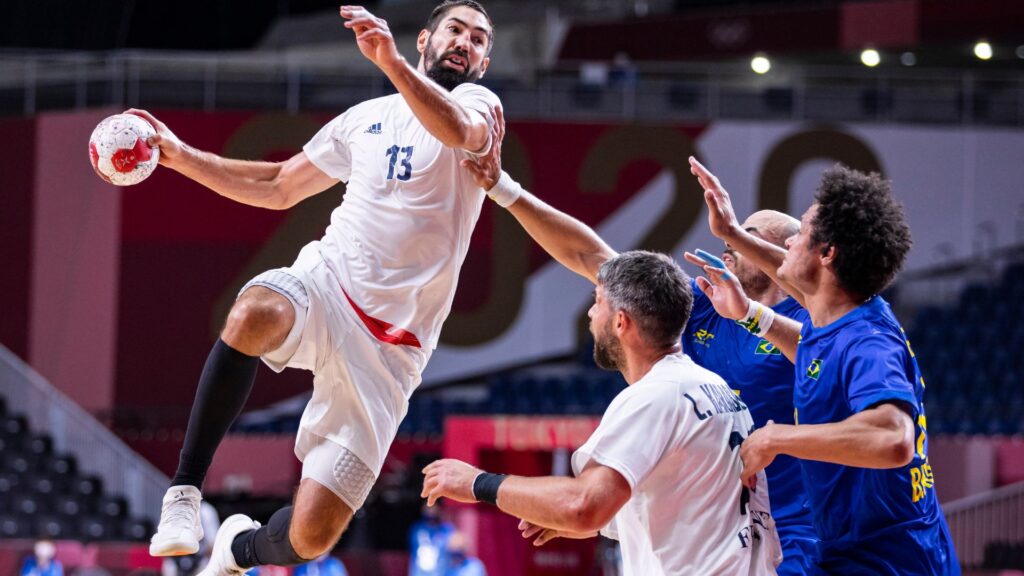  Nikola Karabatic of France, Luka Karabatic of France, Thiagus Petrus of Brazil battle for the ball on day three in the Men's First Round Group A match between Brasil and France during the Tokyo 2020 Olympic Games at Yoyogi National Stadium on July 26, 2021 in Tokyo, Japan. 