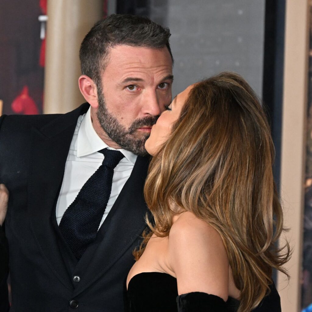 Jennifer Lopez (R) and US actor Ben Affleck kiss as they attend Amazon's "This is Me... Now: A Love Story" premiere at the Dolby theatre in Hollywood, California, February 13, 2024. 