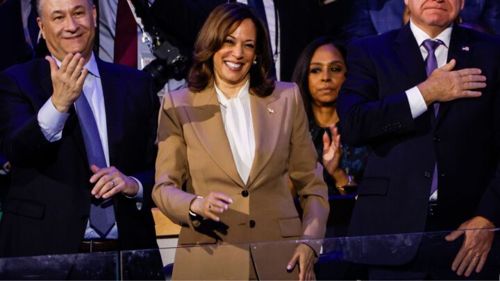 (L-R) Second Gentleman Doug Emhoff, Democratic presidential candidate, U.S. Vice President Kamala Harris, and Democratic vice presidential candidate Minnesota Gov. Tim Walz attend the first day of the Democratic National Convention at the United Center on August 19, 2024 in Chicago, Illinois. Delegates, politicians, and Democratic party supporters are in Chicago for the convention, concluding with current Vice President Kamala Harris accepting her party's presidential nomination. The DNC takes place from August 19-22.