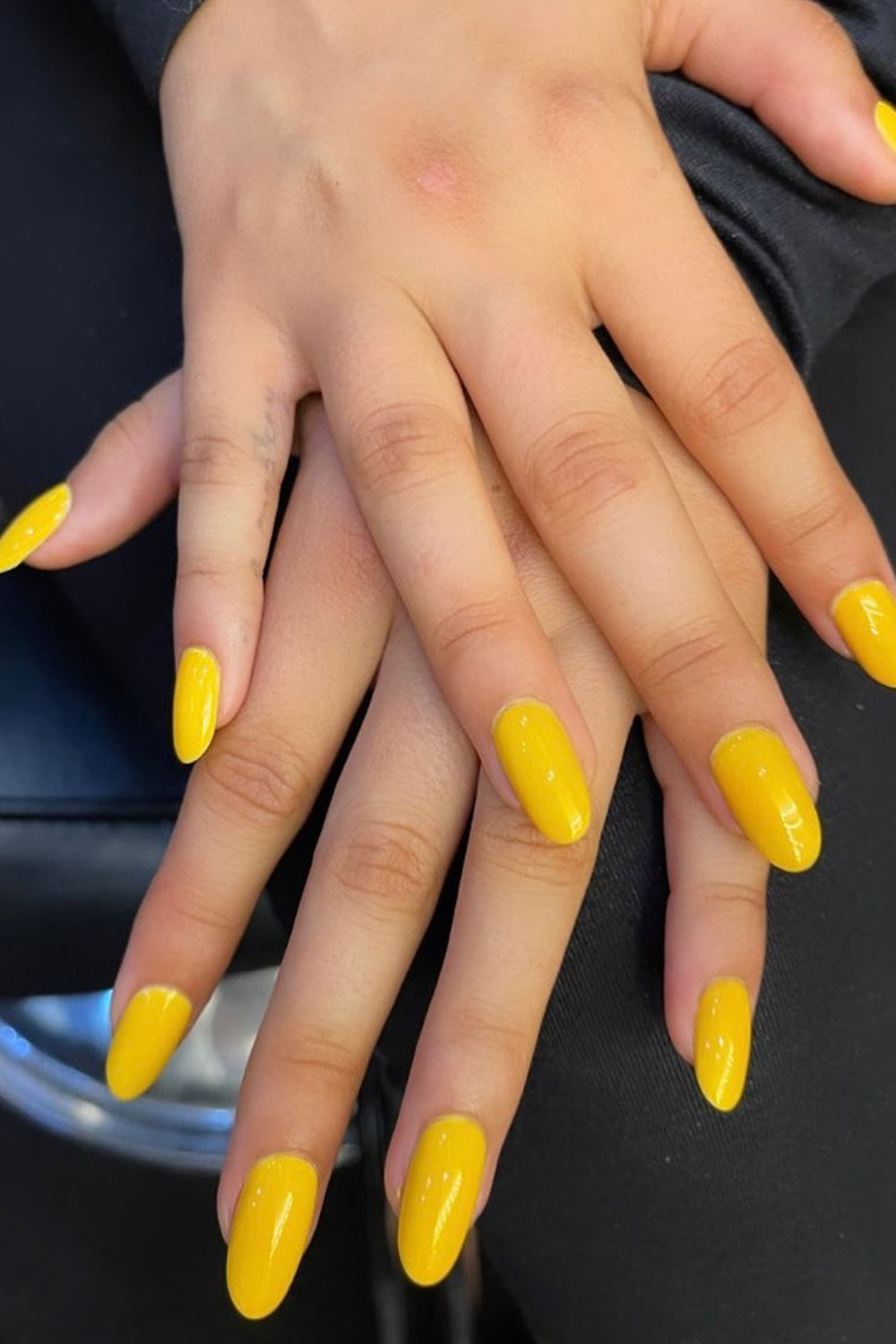 Tom Bachik yellow manicure