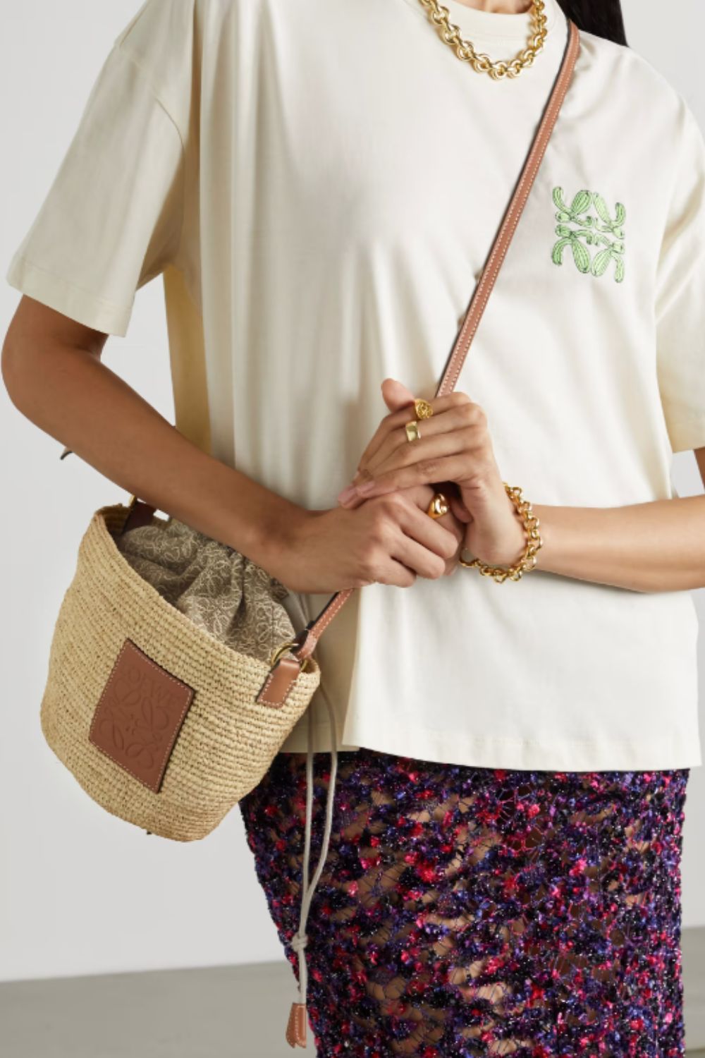 The LOEWE Paula's Ibiza Pochette bag at Net-A-Porter, is a crossbody style ideal for travel