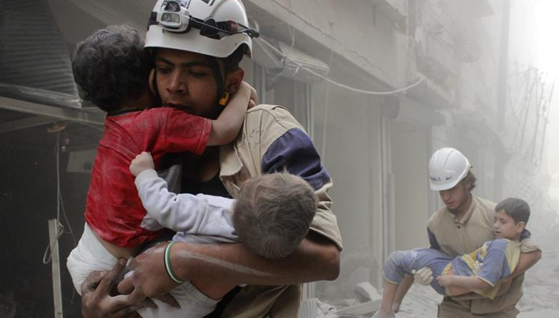 White Helmets taking traumatised children to safety in Aleppo.
