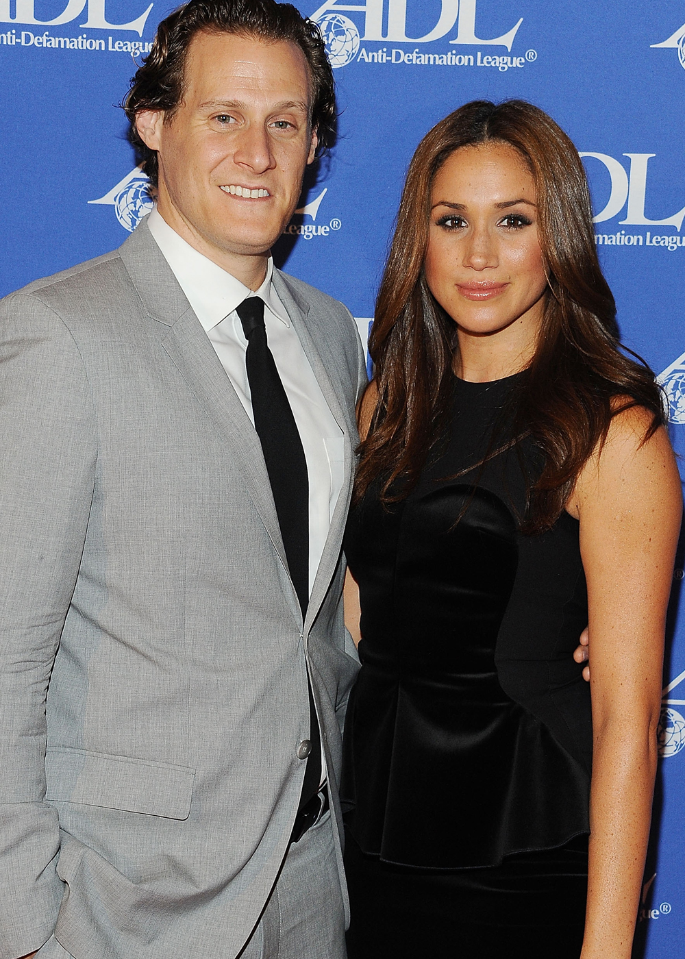 Trevor Engelson and Meghan Markle