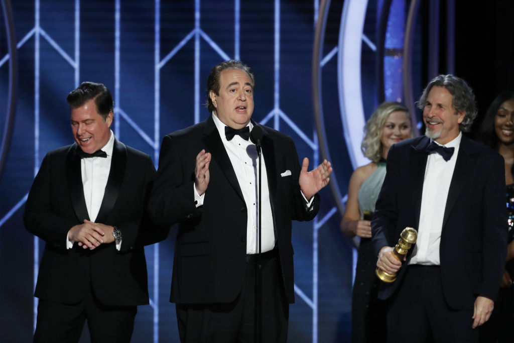 Brian Currie, Nick Vallelonga and Peter Farrelly of “Green Book” accept the Best Screenplay – Motion Picture award onstage