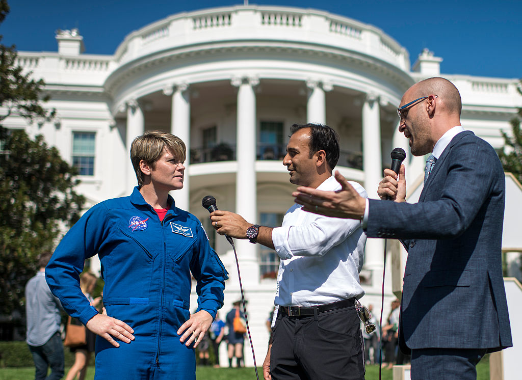 astronaut Ann McClain (L), is interviewed live on social media by U.S. Chief Data Scientist at the White House Office of Science and Technology Policy D. J. Patil (C), and White House Chief Digital Officer Jason Goldman (