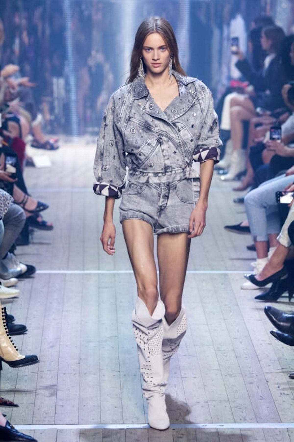Isabel Marant acid wash jean shorts and jacket on the runway in 2019.