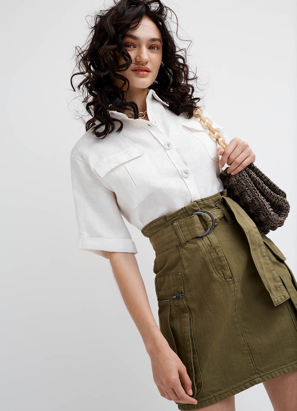 woman in khaki skirt white blouse