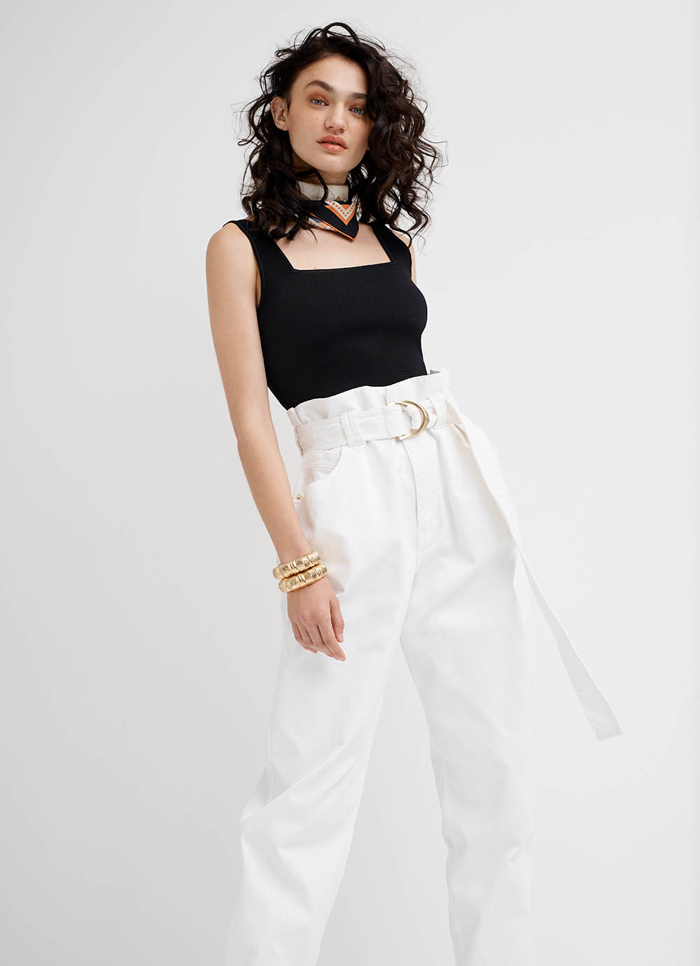 woman in black crop white pants