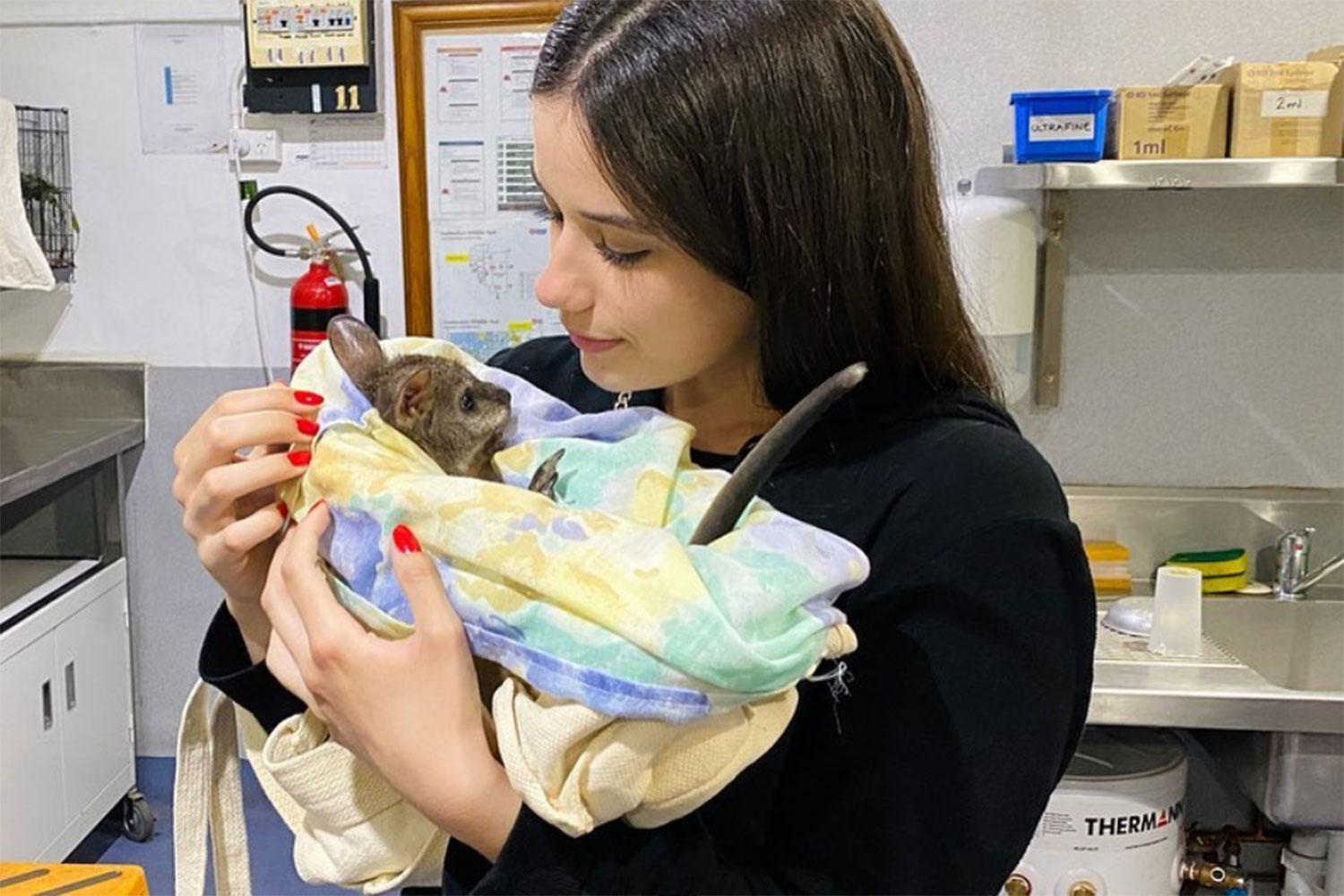 Ella Travolta with a baby kangaroo