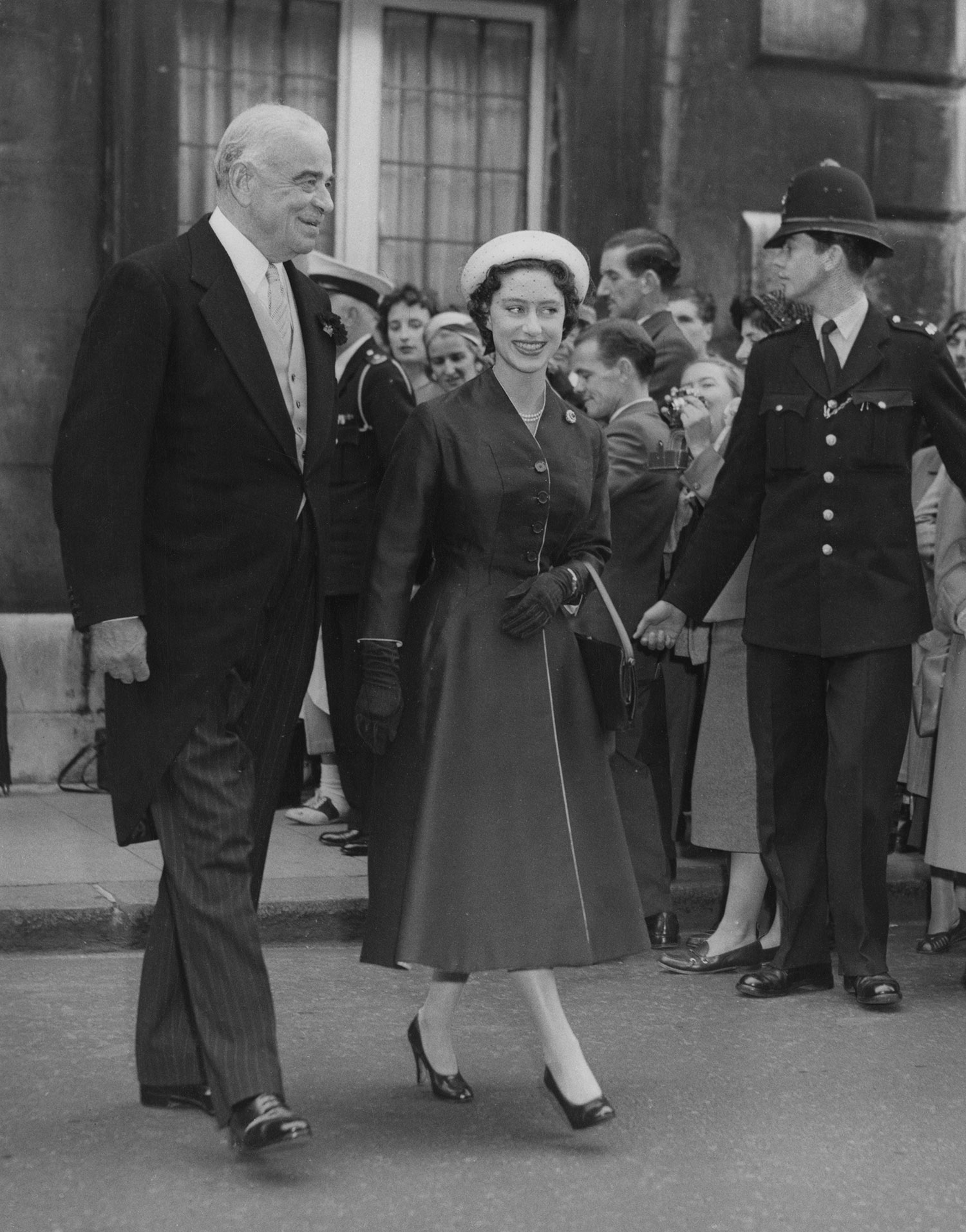 Princess Margaret with Lord Hastings Ismay after the wedding of his daughter, Mary Finnis, to Major Raymond Seymour, in St James', London, September 9, 1957.