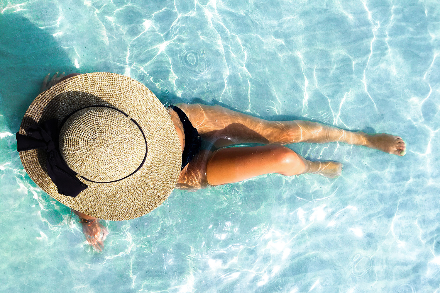 Woman lying in pool