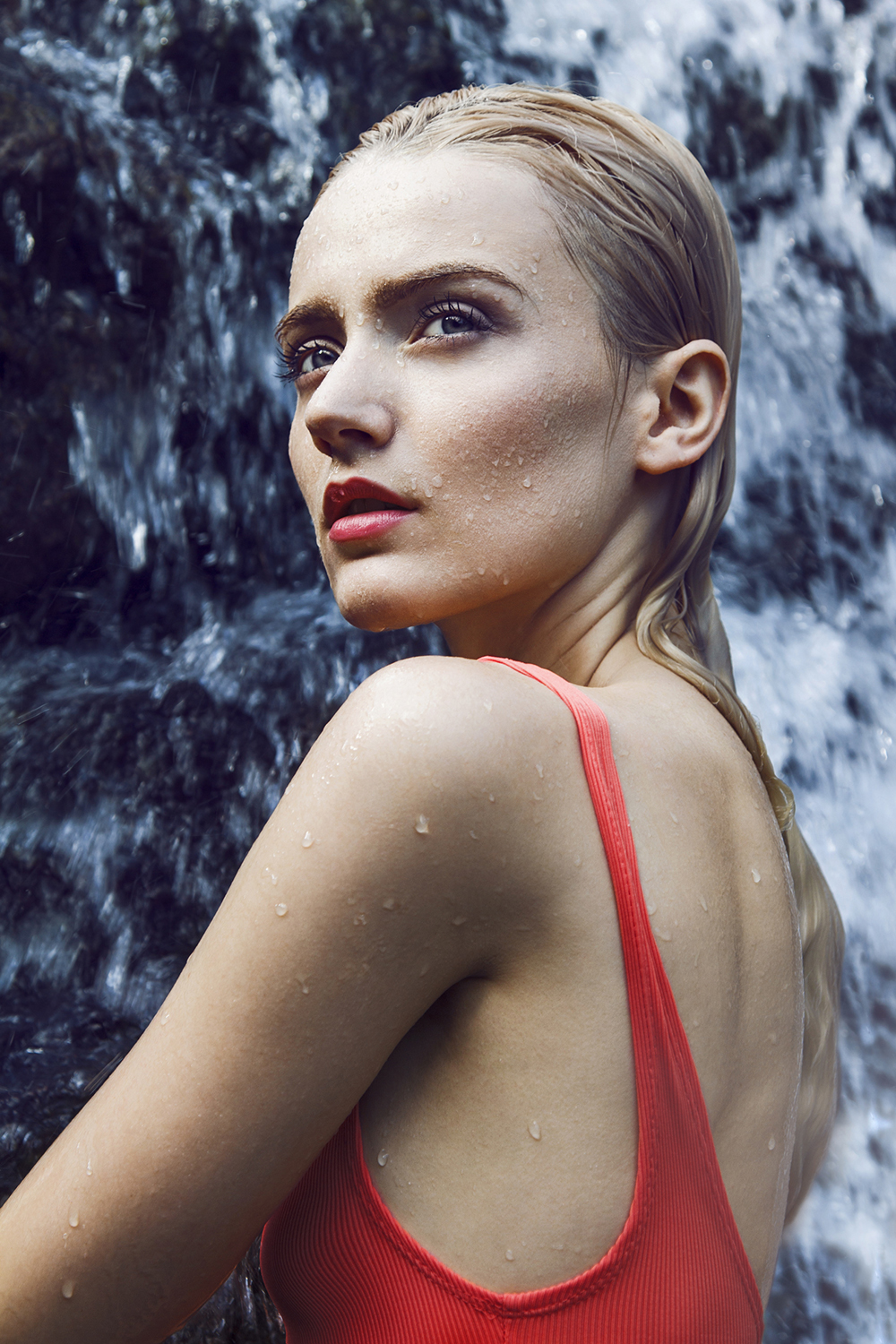 Woman in waterfall