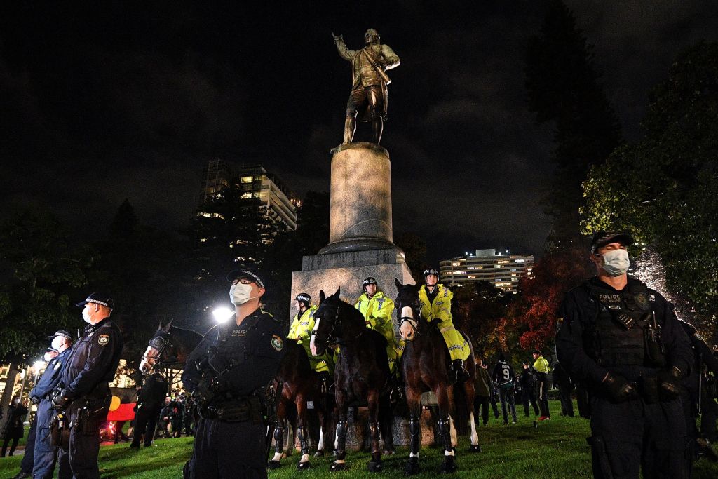 Police protecting the Captain Cool statue in Hyde Park during  a protest rally against Aboriginal deaths in custody.