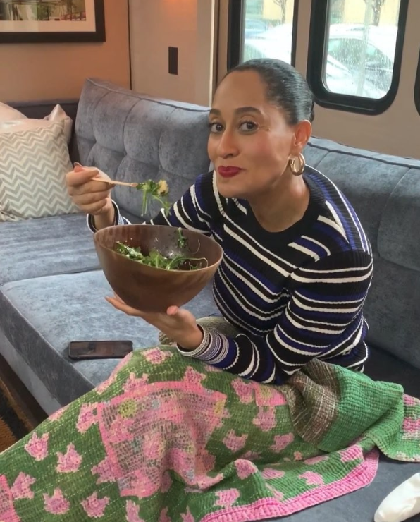 Tracee Ellis Ross eating a salad.