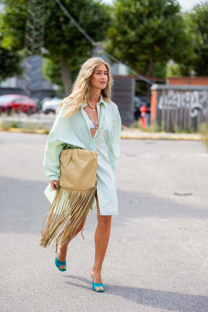 Emili Sindlev carrying the Bottega Veneta Fringe Pouch at Copenhagen Fashion Week