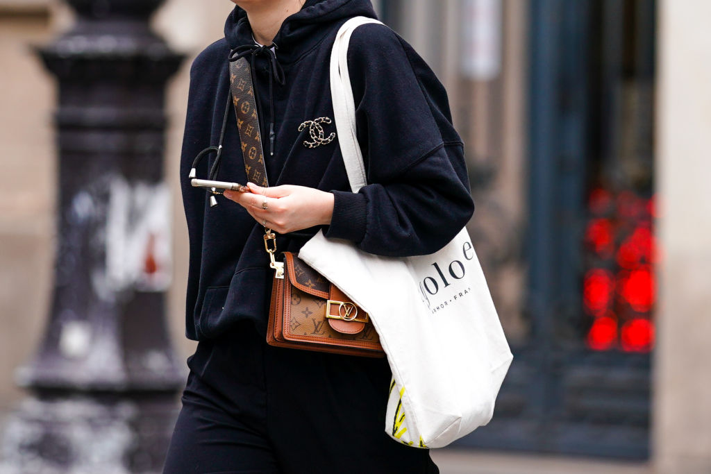 Woman carrying handbag and tote bag